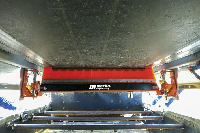 Linear tensioner on a secondary cleaner
