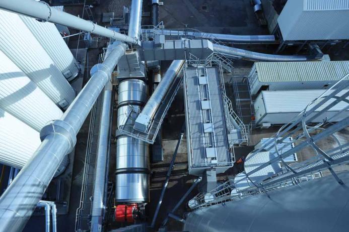 Part of the cold-feed arrangement showing the bitumen tanks, dryer drum with RAH50 central inlet ring, dust filtration system, and filler silo