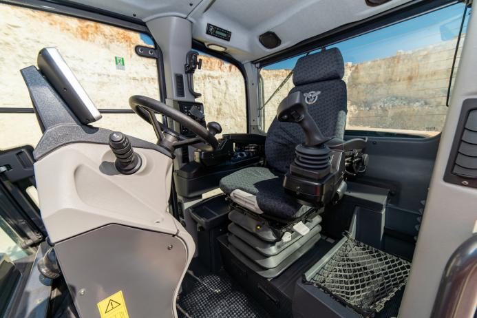 The D-Series graders feature a low-profile ROPS/FOPS cab with electro-hydraulic joystick controls or mechanical levers