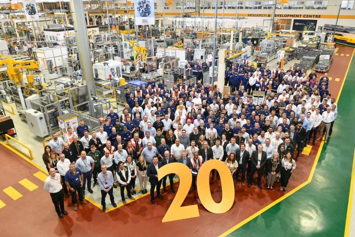 JCB Power Systems employees celebrate the company’s 20th birthday at the plant in Foston, Derbyshire