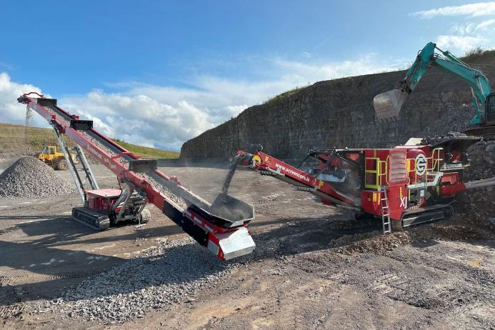 The new Screencore XJ Dual-Power tracked jaw crusher feeding a new 380 Dual-Drive stockpiler