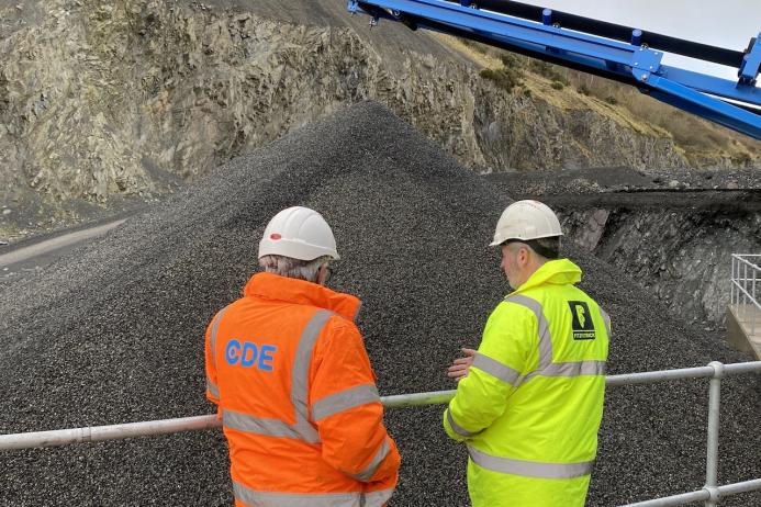 Des Crawford of CDE and Paul Fitzpatrick check out a material stockpile