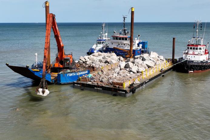 Rock armour from Glensanda was shipped to the east coast where the boat anchored at sea, with a smaller barge transporting approximately 1,000 tonnes of aggregates to the beach twice a day at high tide