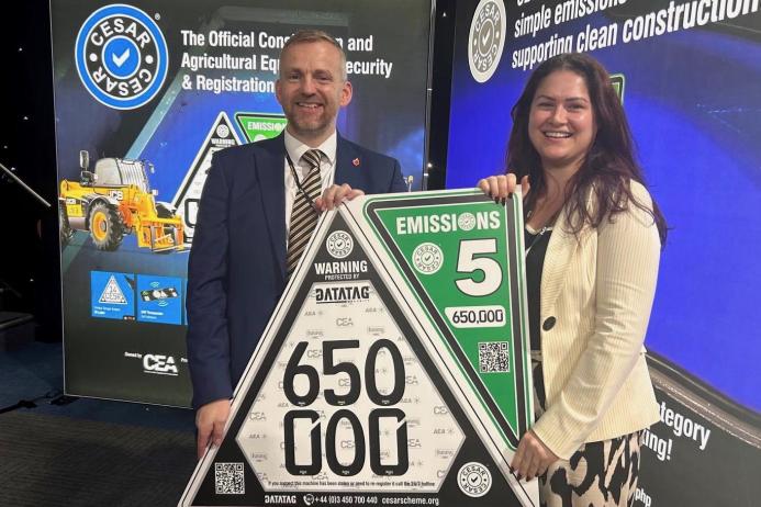 L-R: Steven Mulholland, chief executive officer of the CPA (Construction Plant Hire Association), and Beth Abbott, marketing and communications manager with the CEA, celebrating CESAR’s 650,000th registration milestone