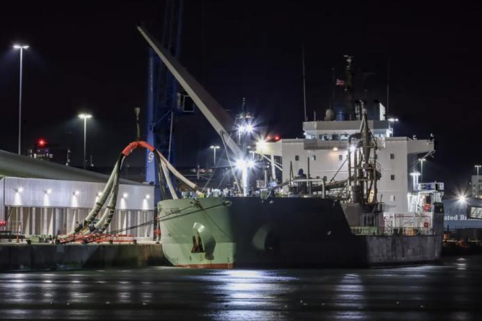 The cement carrier 'NACC Indian' discharging the first shipment of bulk cementitious product