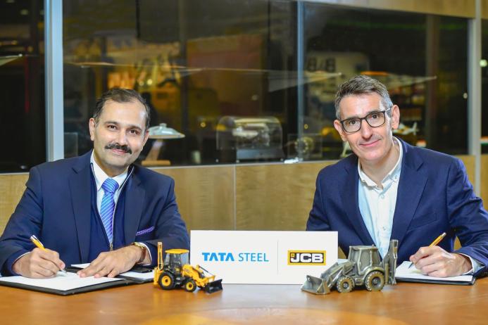 L-R: Anil Jhanji, chief commercial officer of Tata Steel UK, signing the MoU with Wayne Asprey, group purchasing director at JCB