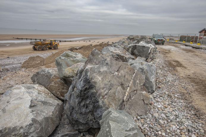 Granite armour-stone is being used to help strengthen vital sea defences at Kinmel Bay 