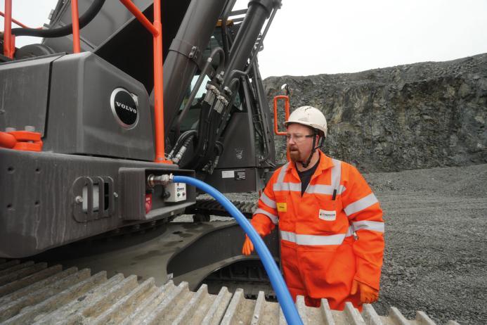 Rhys Morgan, Chepstow Plant engineer at Tarmac’s Dolyhir and Gore quarries, demonstrating the ground-level AdBlue refuelling system on the Volvo EC500 excavator