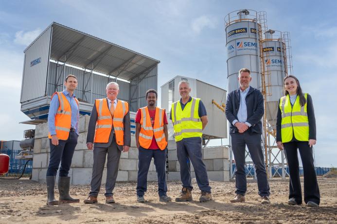 L–R: Prof. David Hughes; Bob Borthwick; Scott Bros recycling innovation engineer Feysal Shifa; Peter Scott; Joss Newberry; and Cassidy Smith, Teesside University’s IP and commercialization manager, at the low-carbon concrete plant