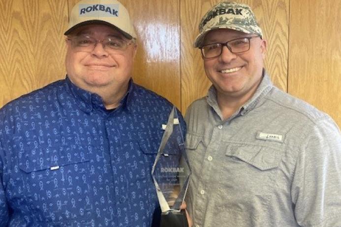 L-R: Dave Totterdale, general manager of sales, and Chad Gilman, vice-president of RECO Equipment, with their Rokbak Dealer of the Year award