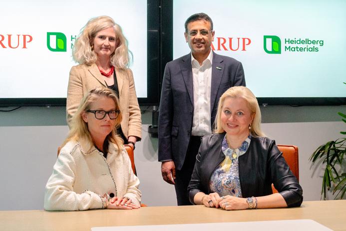 Signing of the Memorandum of Understanding between Heidelberg Materials and Arup. Seated (L-R): Dame Jo da Silva, chief sustainable development officer, Arup; and Dr Katharina Beumelburg, chief sustainability and new technologies officer, Heidelberg Materials. Standing (L-R): Jemima Bruin-Bland, carbon capture and utilization lead - UKIMEA, Arup; and Mubarik Chowdhry, vice-president of global key account and product management for evoZero, Heidelberg Materials