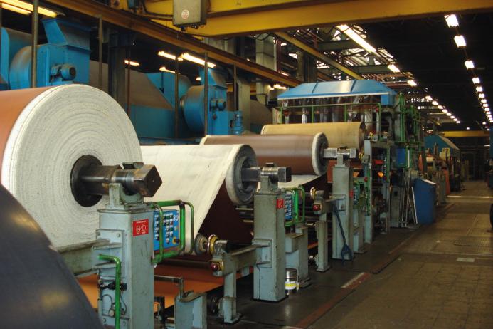 The production line must be stopped and reset to accommodate any change of belt specification