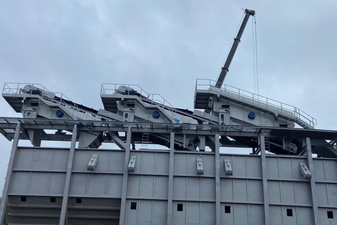 Three of the four new QMS screens during installation