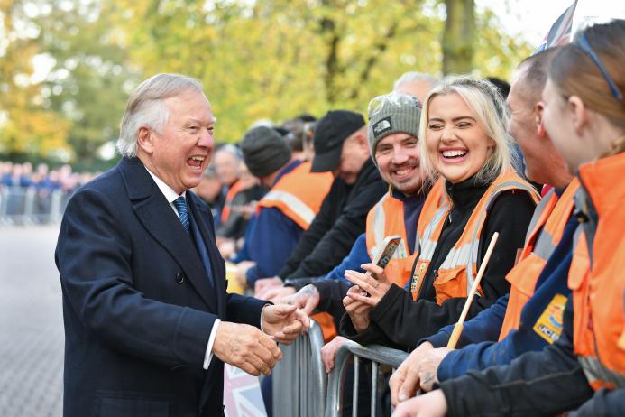 Lord Bamford chats to employees upon his arrival at JCB’s World Headquarters
