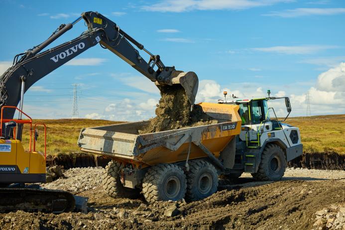A Liebherr TA 230 ADT being loaded by a Volvo excavator