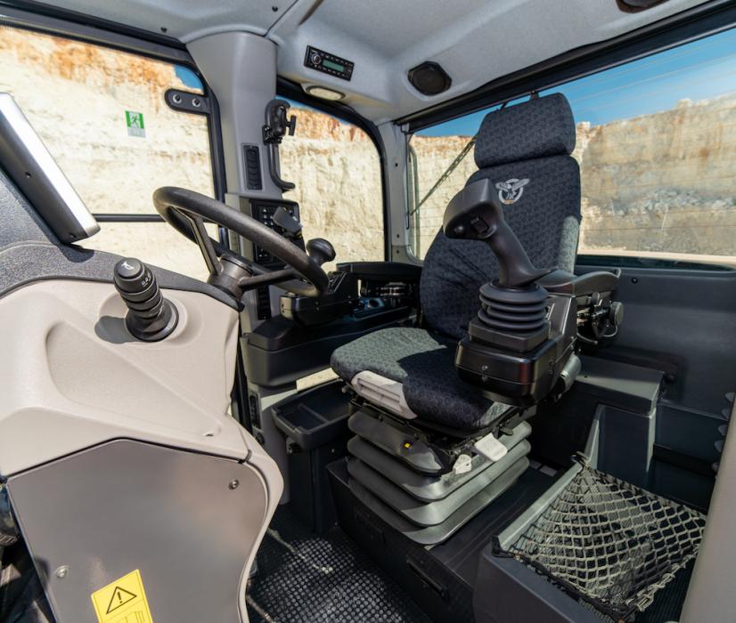 The D-Series graders feature a low-profile ROPS/FOPS cab with electro-hydraulic joystick controls or mechanical levers