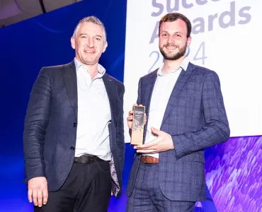 Sam Farnsworth (right) accepting the Customer Success Award for Excellence in Analytical Insights from Pete Wilkinson, managing director of Esri UK