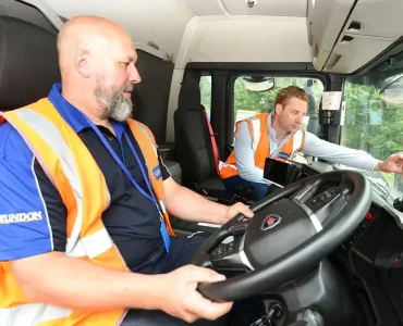 Chris Double (pictured right), Grundon’s regional operations manager, briefs colleague Jason Warrick on the new AI-led dash cams from Samsara