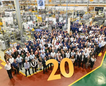 JCB Power Systems employees celebrate the company’s 20th birthday at the plant in Foston, Derbyshire