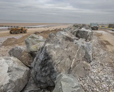 Granite armour-stone is being used to help strengthen vital sea defences at Kinmel Bay 