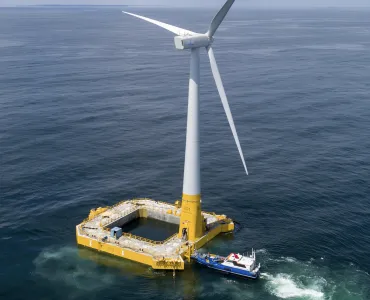 Offshore wind turbine with floating concrete foundation