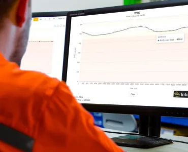 An engineer remotely monitors the cyclic loading of a bolted connection
