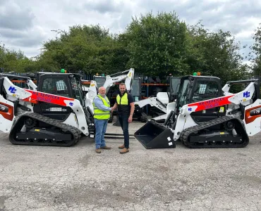 L-R: Malcolm Gough, national hire manager at H.E. Services, and Graham Deacon, national and key accounts sales manager for Doosan Bobcat for the UK and Ireland, with some of the new T76 tracked loaders