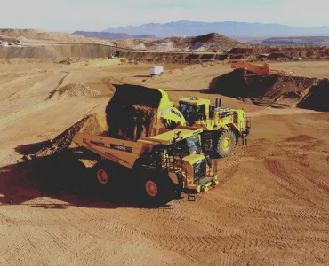 An autonomous Komatsu HD605-10 rigid dumptruck being loaded at Komatsu’s Arizona proving grounds