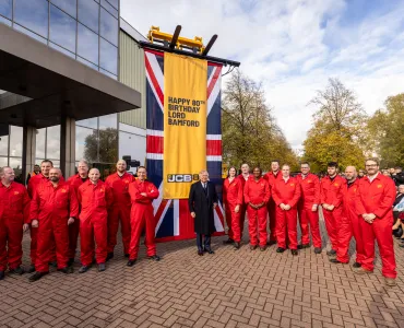 JCB’s demonstration team and Lord Bamford