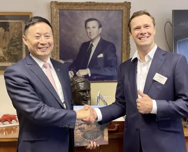 L-R: Ming XU, senior vice-president of SANY Group, and Alexander Scott, chief executive officer of TH White Group, at the signing ceremony marking the formal agreement between the two organizations