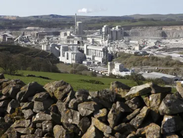 Carbon dioxide emissions generated by the UK concrete and cement sector are now 63% lower than 1990 levels