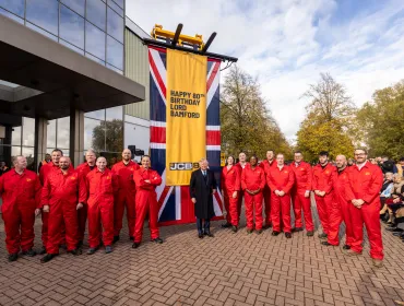 JCB’s demonstration team and Lord Bamford
