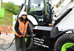 The Secretary of State for Energy Security and Net Zero, Claire Coutinho MP, tries her hand at the quick and easy task of refuelling a JCB backhoe loader with hydrogen