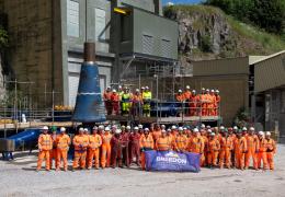 Contract partners and project team members with the new FLSmidth primary gyratory prior to installation at Hope works.