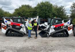L-R: Malcolm Gough, national hire manager at H.E. Services, and Graham Deacon, national and key accounts sales manager for Doosan Bobcat for the UK and Ireland, with some of the new T76 tracked loaders