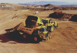 An autonomous Komatsu HD605-10 rigid dumptruck being loaded at Komatsu’s Arizona proving grounds