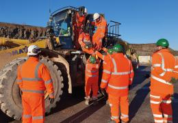 Cauldon Low – lowering a casualty from an elevated cab with two people at cab height, supported by two more people on the ground to receive the casualty