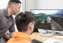 Fragmentation camera analysis of blasted material at a primary crusher tipping point