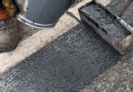 Elastomac rubberized road repair material