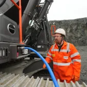 Rhys Morgan, Chepstow Plant engineer at Tarmac’s Dolyhir and Gore quarries, demonstrating the ground-level AdBlue refuelling system on the new Volvo EC500F excavator   