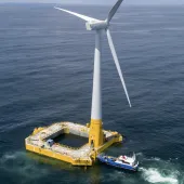 Offshore wind turbine with floating concrete foundation
