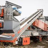 The patented recirculation conveyor on the portable Sentry HSI plant from Superior