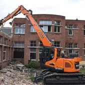 Belgium-based De Schepper Kris’s new Develon DX140RDM-7 demolition excavator at work 