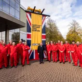 JCB’s demonstration team and Lord Bamford