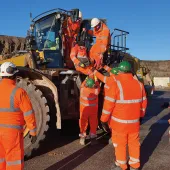 Cauldon Low – lowering a casualty from an elevated cab with two people at cab height, supported by two more people on the ground to receive the casualty