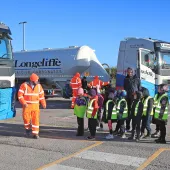 Cromford Primary School students are taken through road safety exercises with Longcliffe health and safety manager Tony Woodroffe (left)
