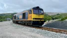 The first train leaving via the newly reinstated rail link at Horton Quarry