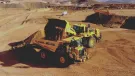 An autonomous Komatsu HD605-10 rigid dumptruck being loaded at Komatsu’s Arizona proving grounds