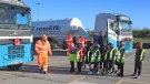 Cromford Primary School students are taken through road safety exercises with Longcliffe health and safety manager Tony Woodroffe (left)